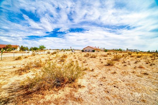 411 North Nolan Street Ridgecrest, CA 93555 - Photo 42 of 43 a view of a dry yard with wooden fence