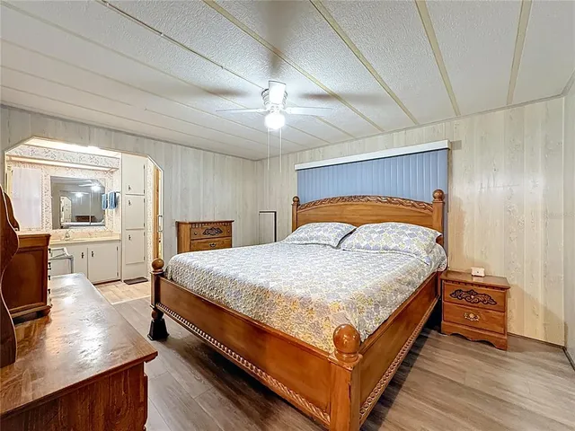 a bathroom with a granite countertop sink mirror and shower