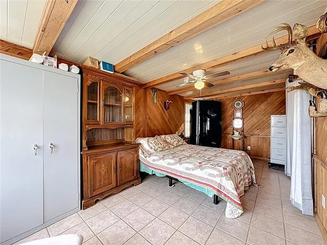 a hallway with wooden floor and furniture