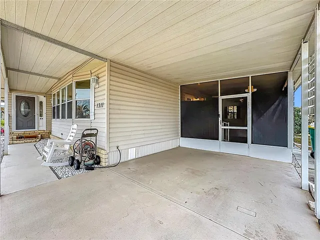 an aerial view of a house with a lake view