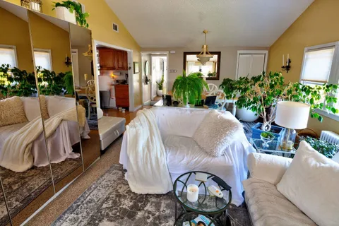 a view of a livingroom with furniture and a table