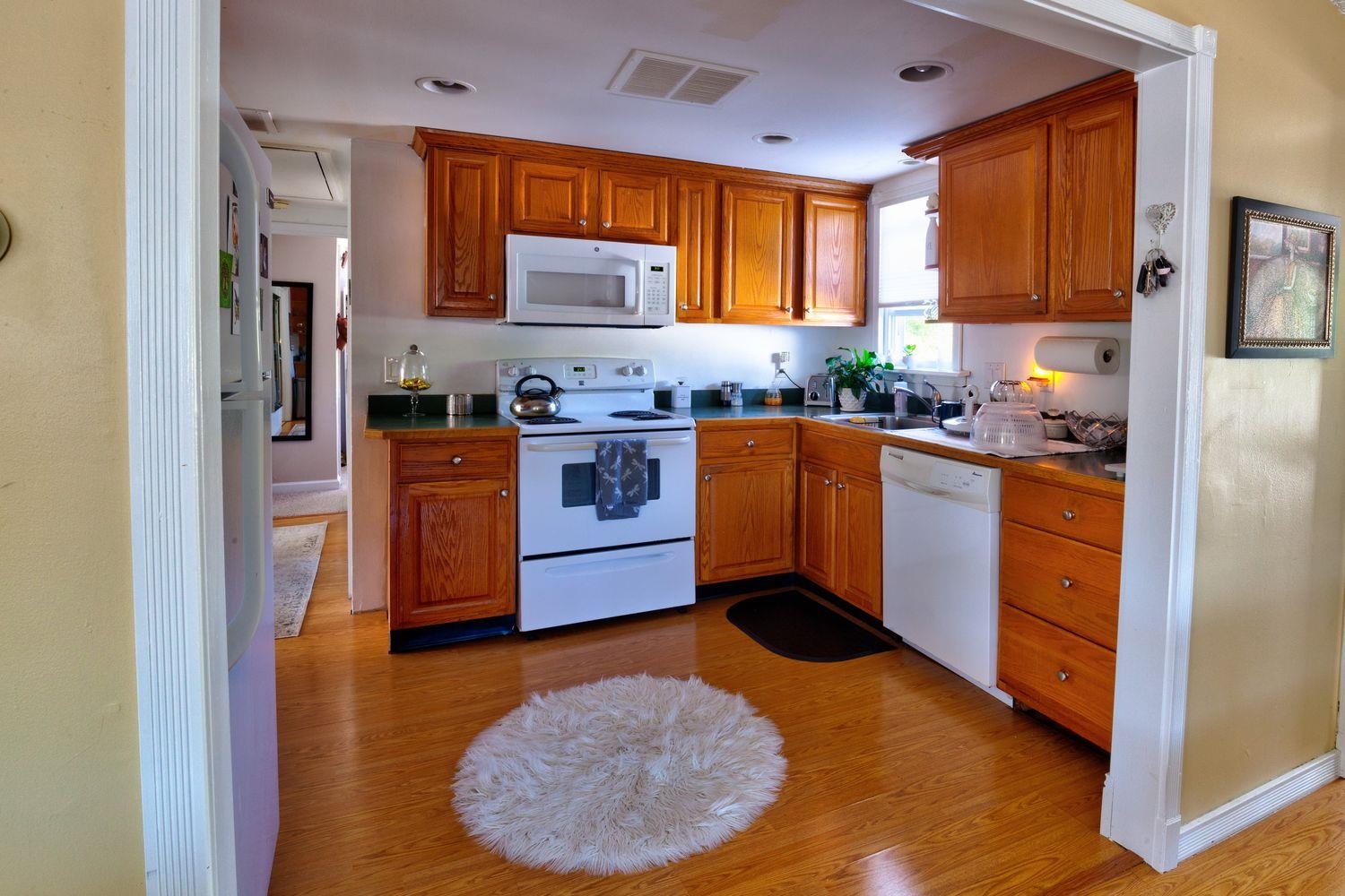14 Lyndhurst Road Marmora, NJ 08223 - Photo 12 of 38 a kitchen with stainless steel appliances granite countertop a stove a refrigerator and a sink