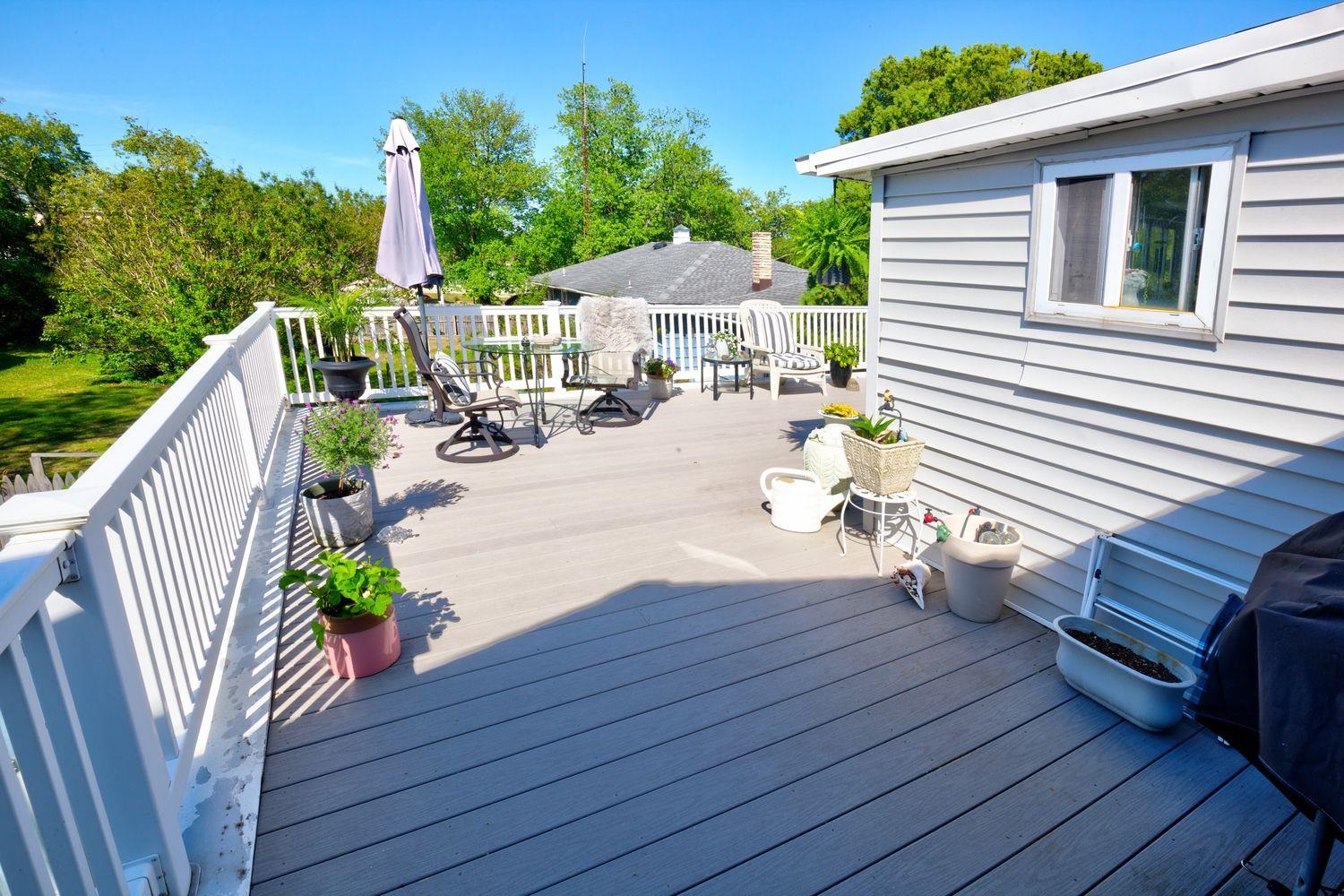 14 Lyndhurst Road Marmora, NJ 08223 - Photo 13 of 38 a view of a deck with couches table and chairs with wooden floor and fence
