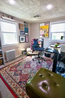 a living room with furniture and a rug