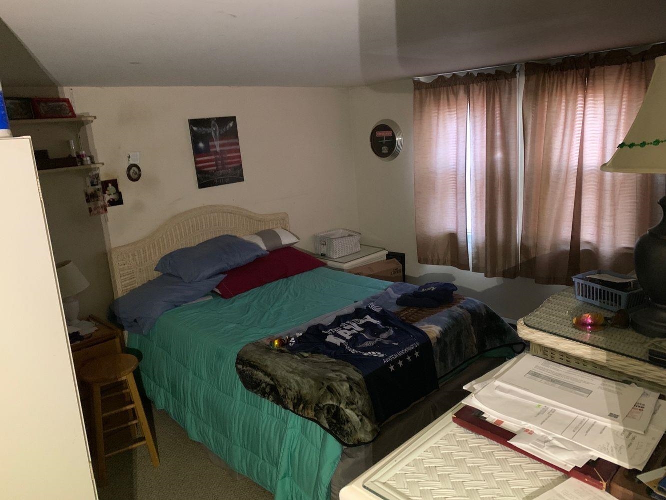 14 Lyndhurst Road Marmora, NJ 08223 - Photo 24 of 38 a bedroom with a bed and a flat tv screen