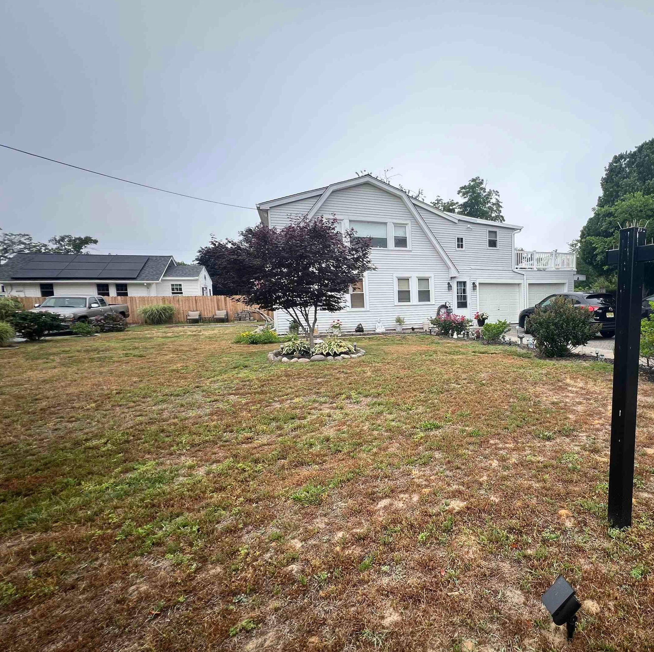 14 Lyndhurst Road Marmora, NJ 08223 - Photo 37 of 38 a view of a house with a yard and sitting area