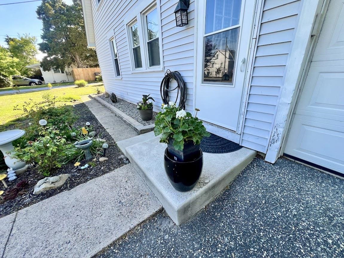 14 Lyndhurst Road Marmora, NJ 08223 - Photo 7 of 38 a view of a house with a tub and a garden