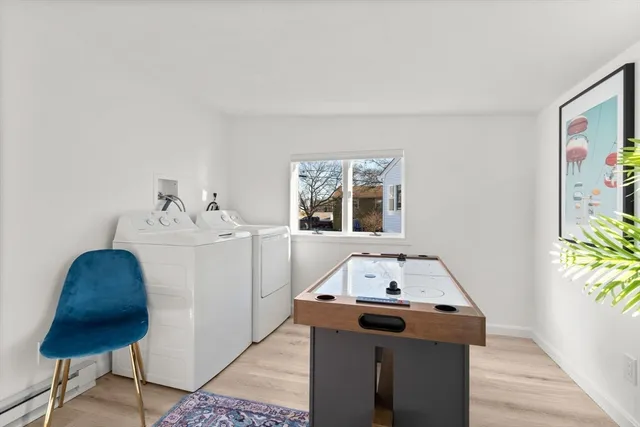 a living room with a sink and a window