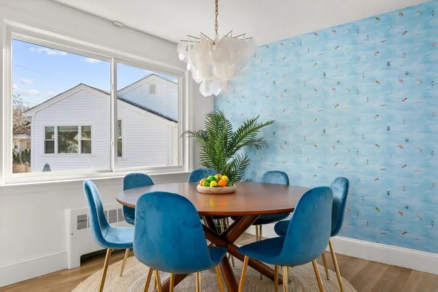 a dining room with furniture and window