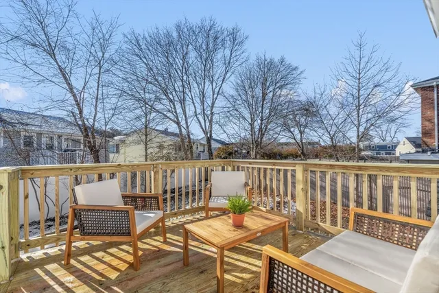 a view of a chairs and table on the deck