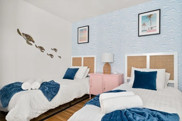 a bedroom with furniture and a window