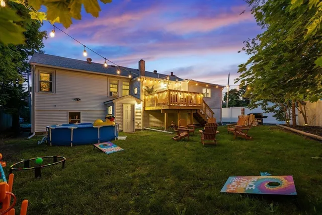 a front view of a house with a garden and yard
