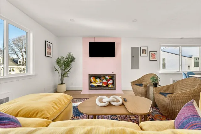 a bedroom with furniture and a flat screen tv