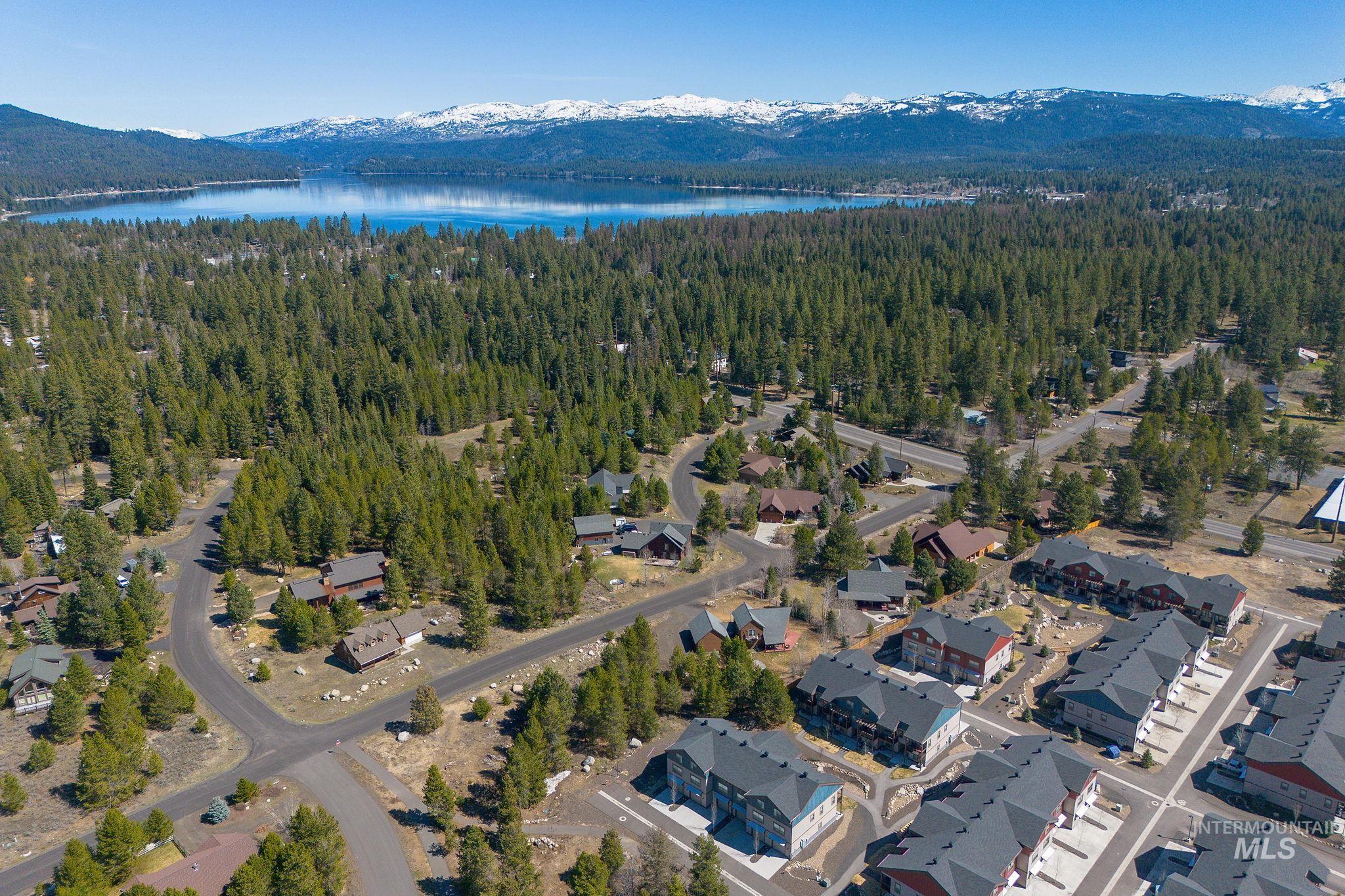 311 Broken Ridge Way McCall, ID 83638 - Photo 32 of 44 Aerial perspective showcasing a community nestled within extensive evergreen forests