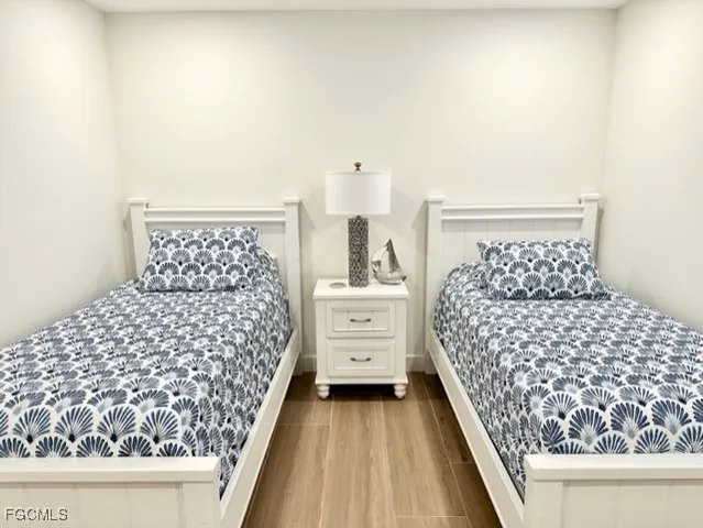 a bedroom with a large bed and a dresser