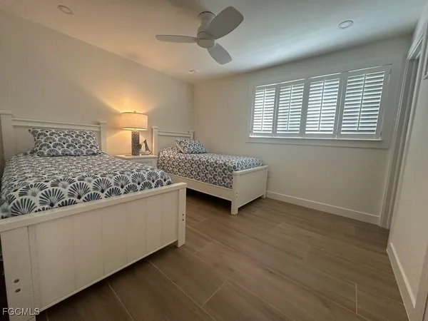 a living room with a bed furniture and a window