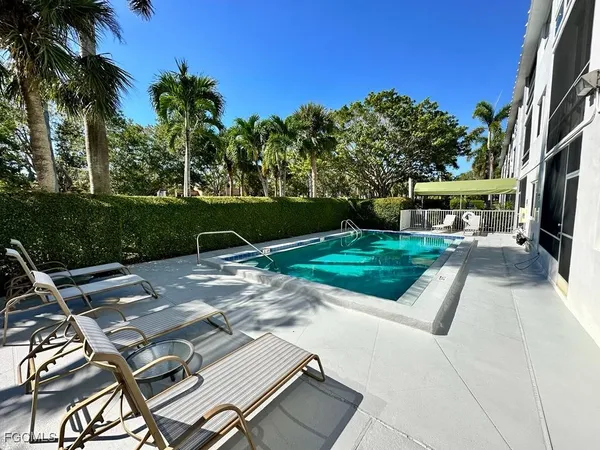 a view of a backyard with a sitting area