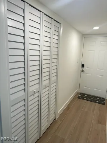 an empty room with wooden floor