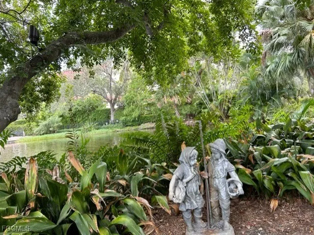 a view of a chair and table in backyard