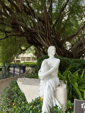 a front view of a building with garden