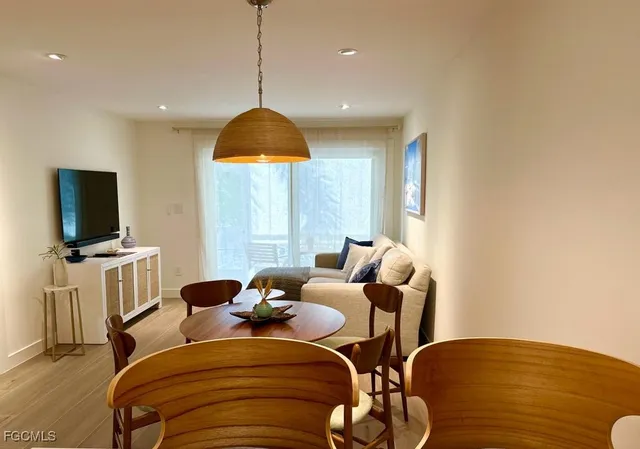 a view of a livingroom with furniture and a flat screen tv