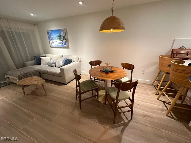 a work room with furniture and wooden floor