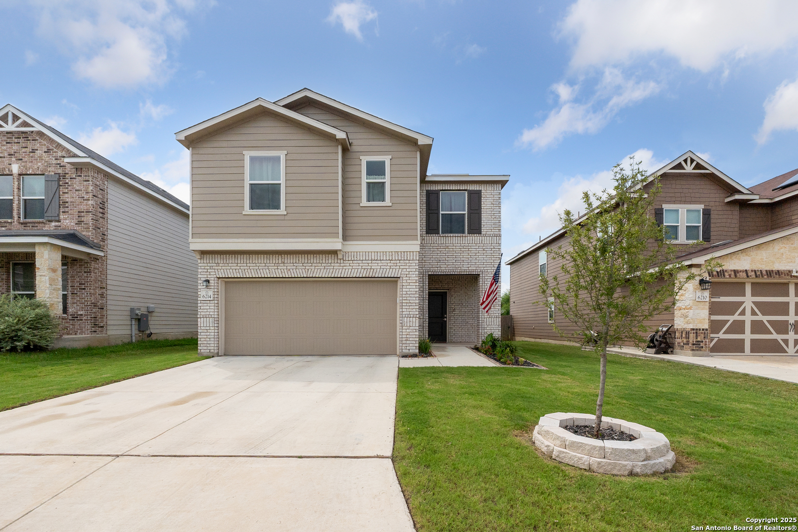 6214 Travis Summit San Antonio, TX 78218 - Photo 1 of 1 a front view of a house with a yard