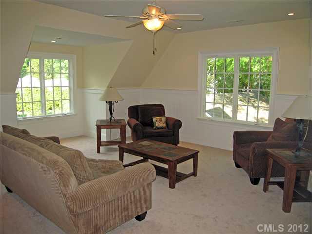 1513 Coventry Road Charlotte, NC 28211 - Photo 14 of 16 a living room with furniture and a chandelier
