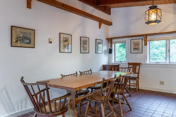 a view of a dining room with furniture and chandelier