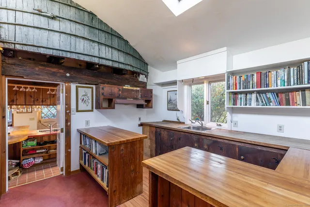a room with furniture and a book shelf