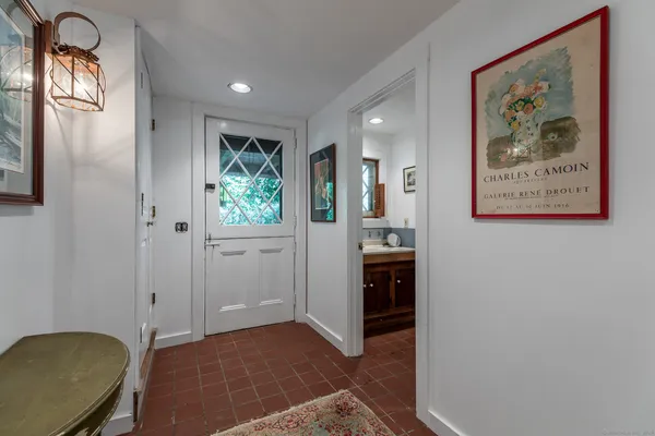 a front view of a house with parking space