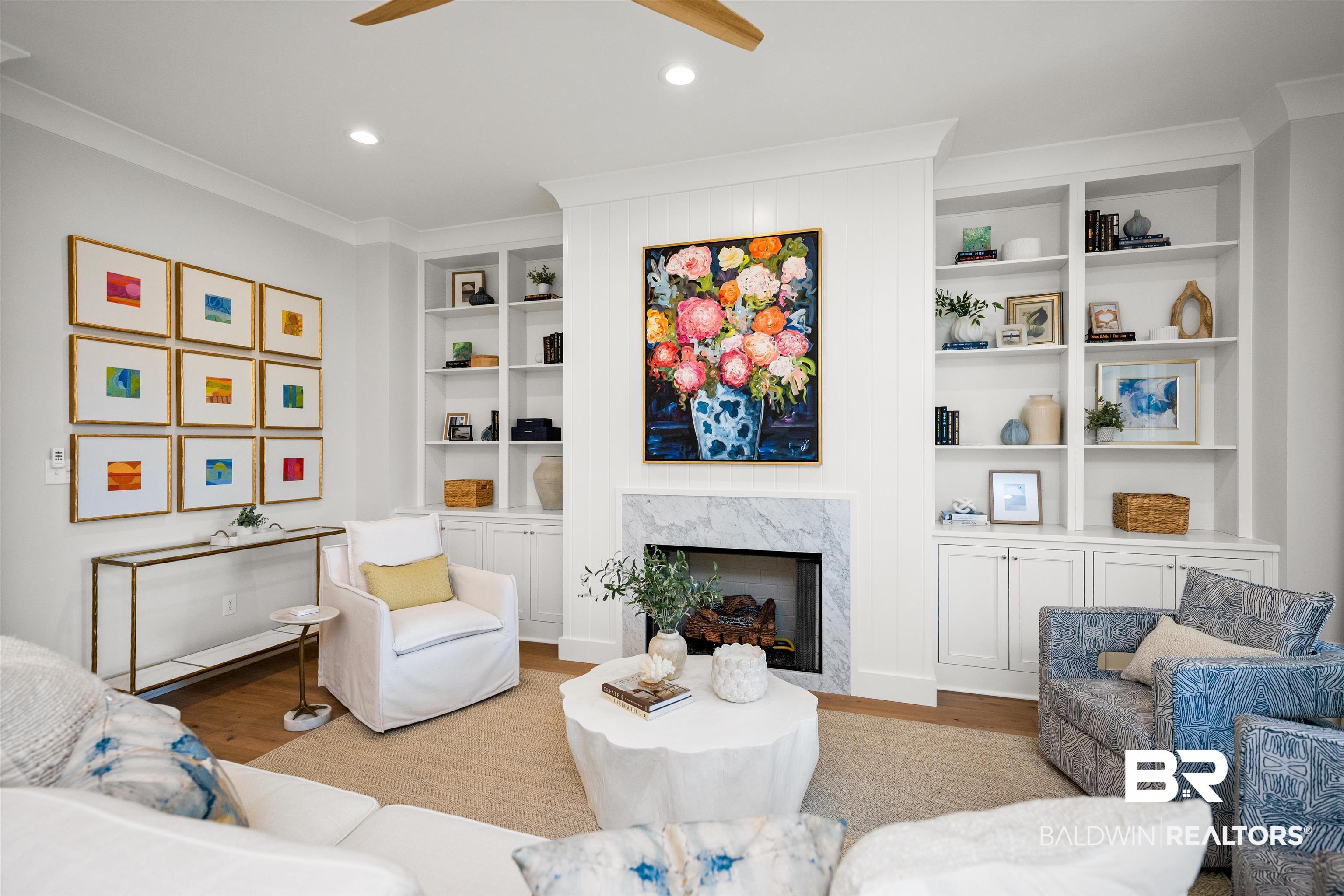 156 Hyacinth Street Fairhope, AL 36532 - Photo 9 of 61 Living area featuring a fireplace, built in shelves, light wood-style flooring, recessed lighting, and ceiling fan