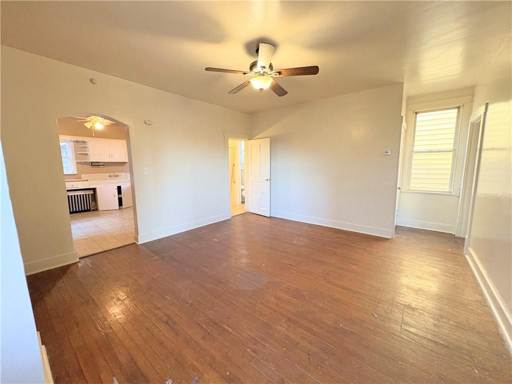 1604 Ridge Avenue, Unit 1 Braddock, PA 15104 - Photo 4 of 6 a view of a room with a window and wooden floor
