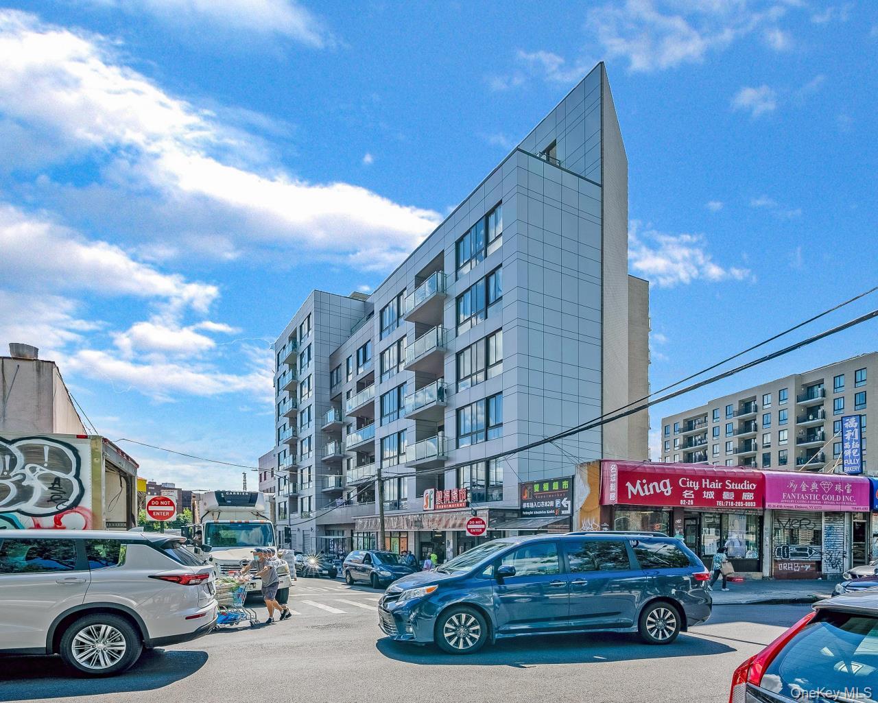 45-16 83rd Street, Unit E2D Queens, NY 11373 - Photo 3 of 11 a car parked in front of a building