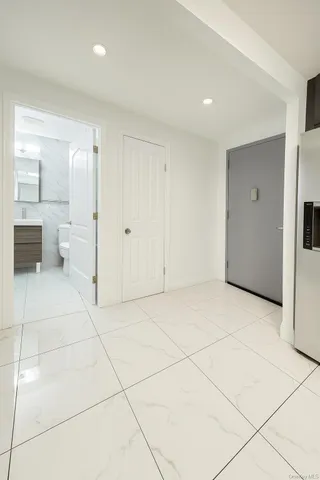 a bathroom with a toilet a sink and bathtub