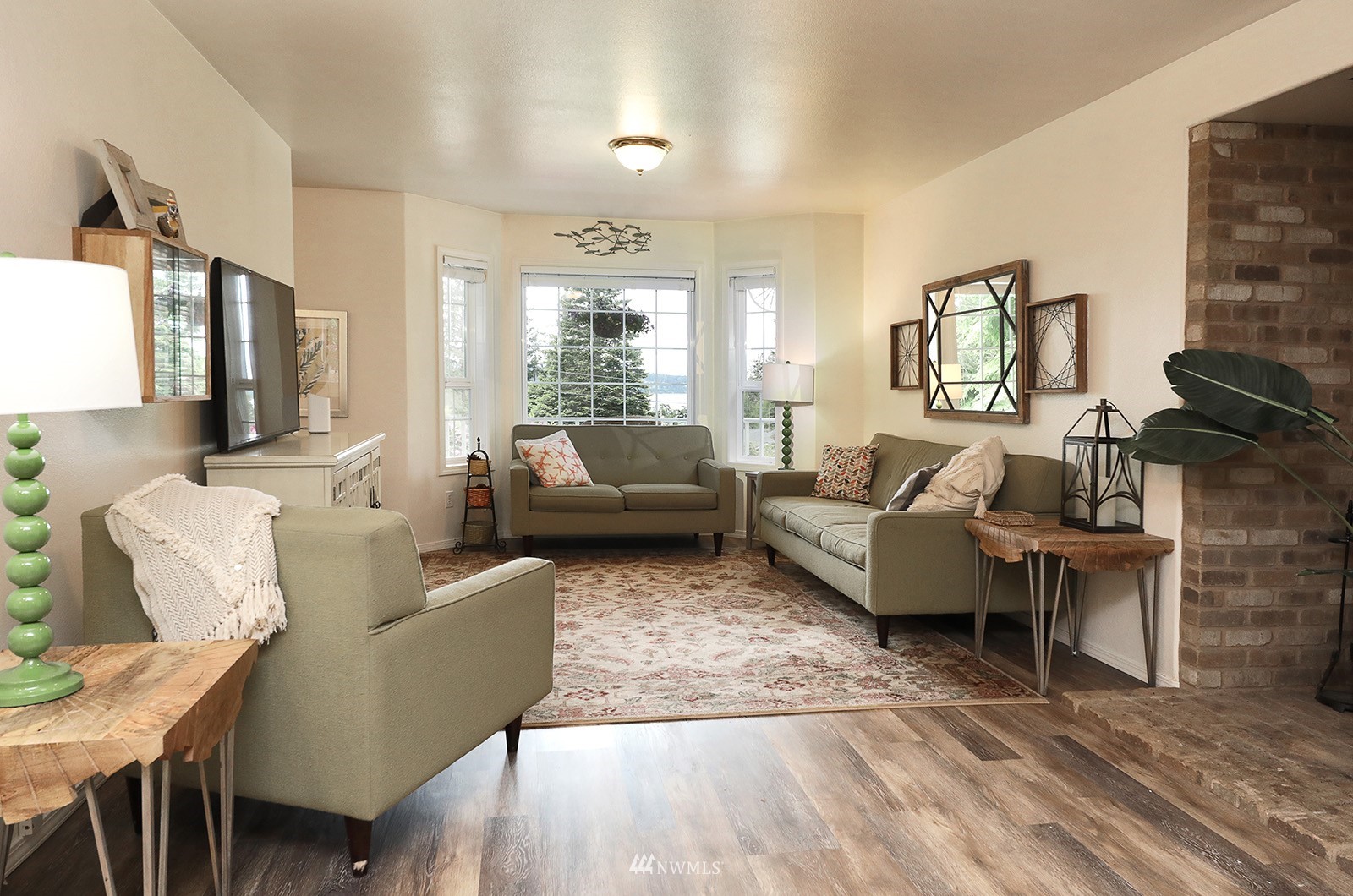 3277 East Harbor Road Langley, WA 98260 - Photo 22 of 40 a living room with furniture and a large window