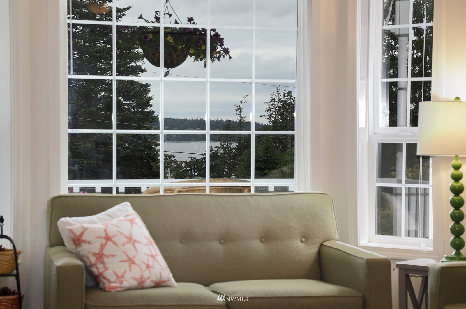 3277 East Harbor Road Langley, WA 98260 - Photo 23 of 40 a living room with furniture and a window