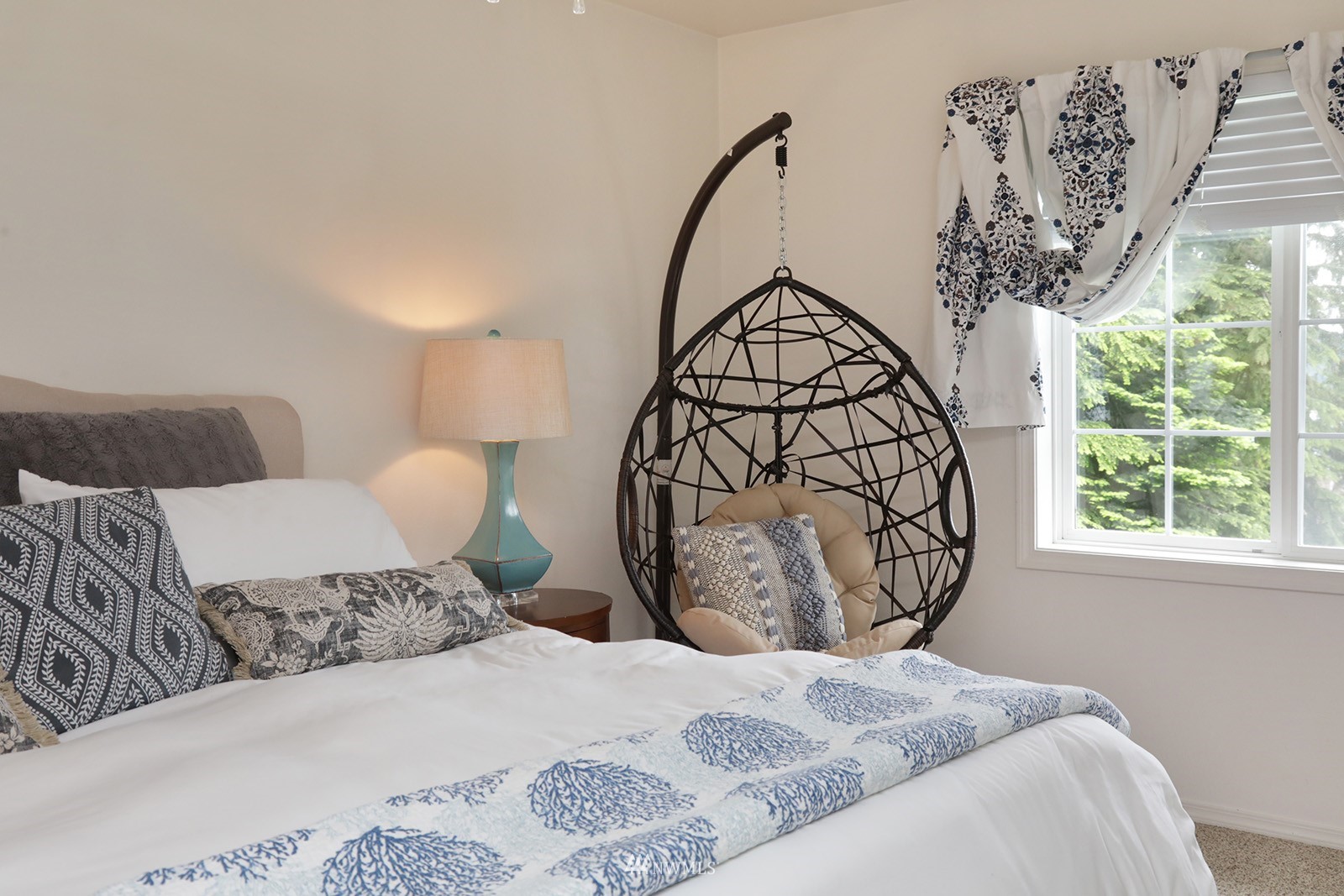 3277 East Harbor Road Langley, WA 98260 - Photo 24 of 40 a bedroom with a large bed and a window