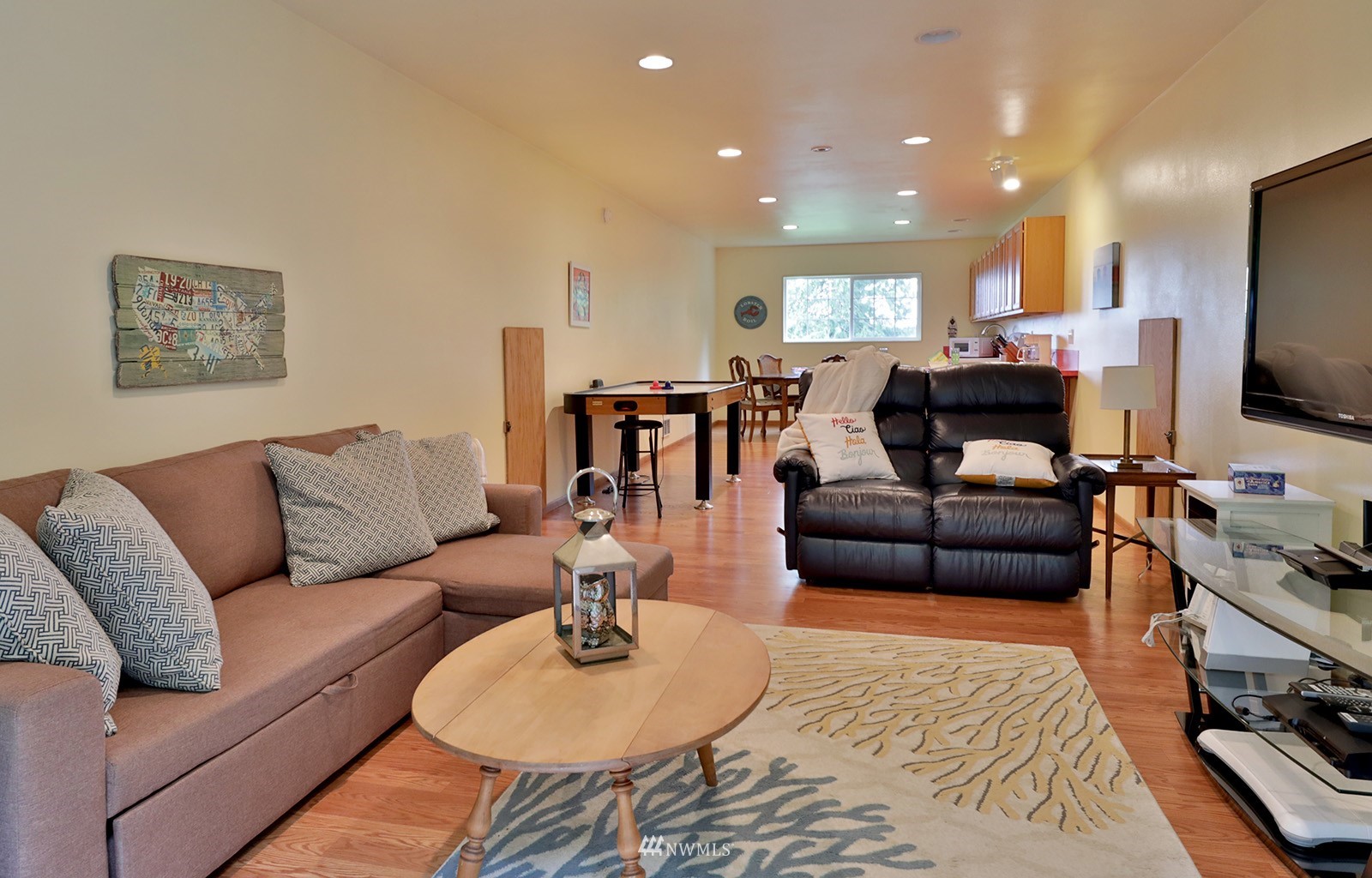 3277 East Harbor Road Langley, WA 98260 - Photo 32 of 40 a living room with furniture and a flat screen tv