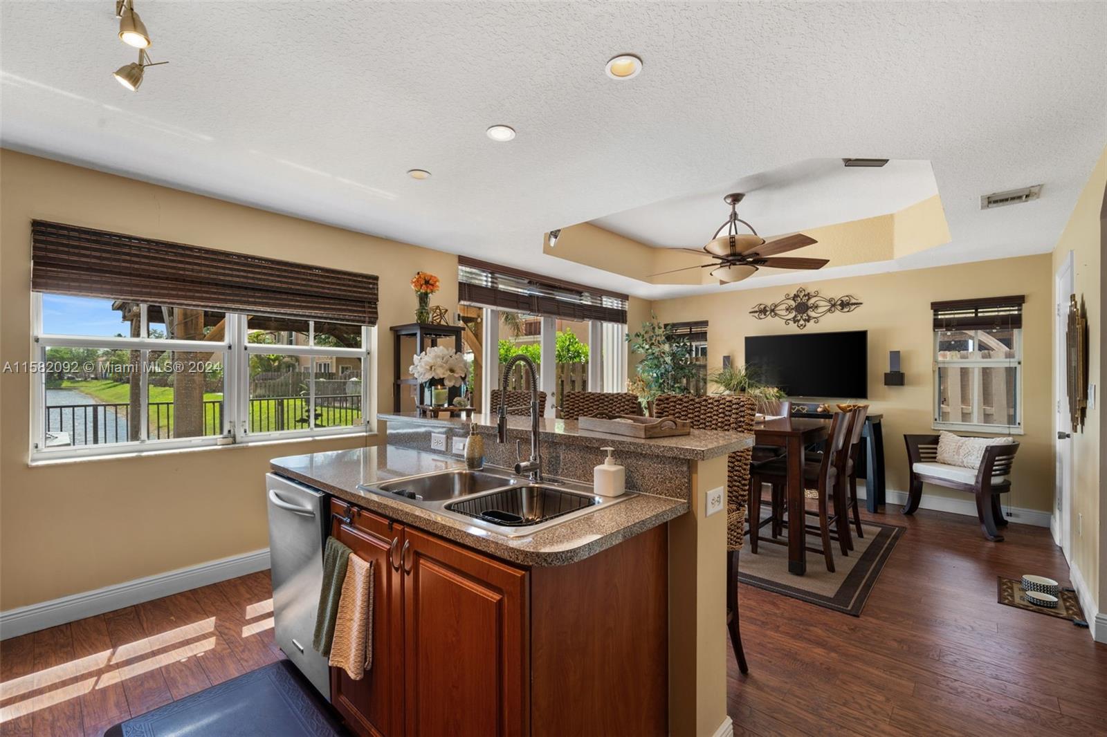 3091 Southwest 153rd Path Miami, FL 33185 - Photo 11 of 34 a kitchen with sink cabinets and wooden floor