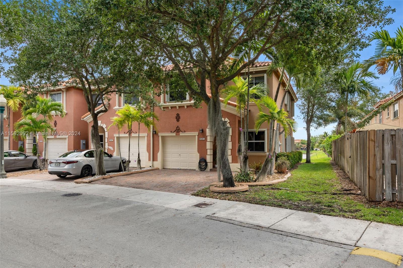 3091 Southwest 153rd Path Miami, FL 33185 - Photo 2 of 34 a view of a car park in front of house