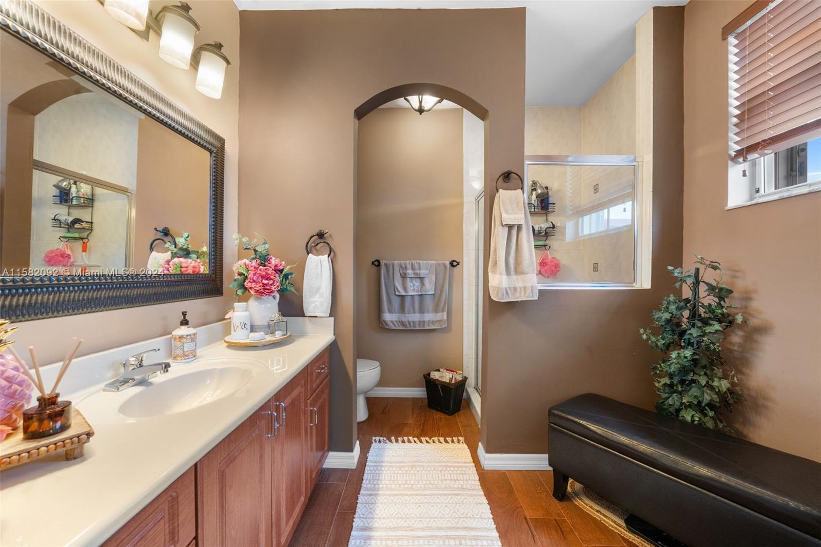 3091 Southwest 153rd Path Miami, FL 33185 - Photo 22 of 34 a bathroom with a sink mirror and vanity