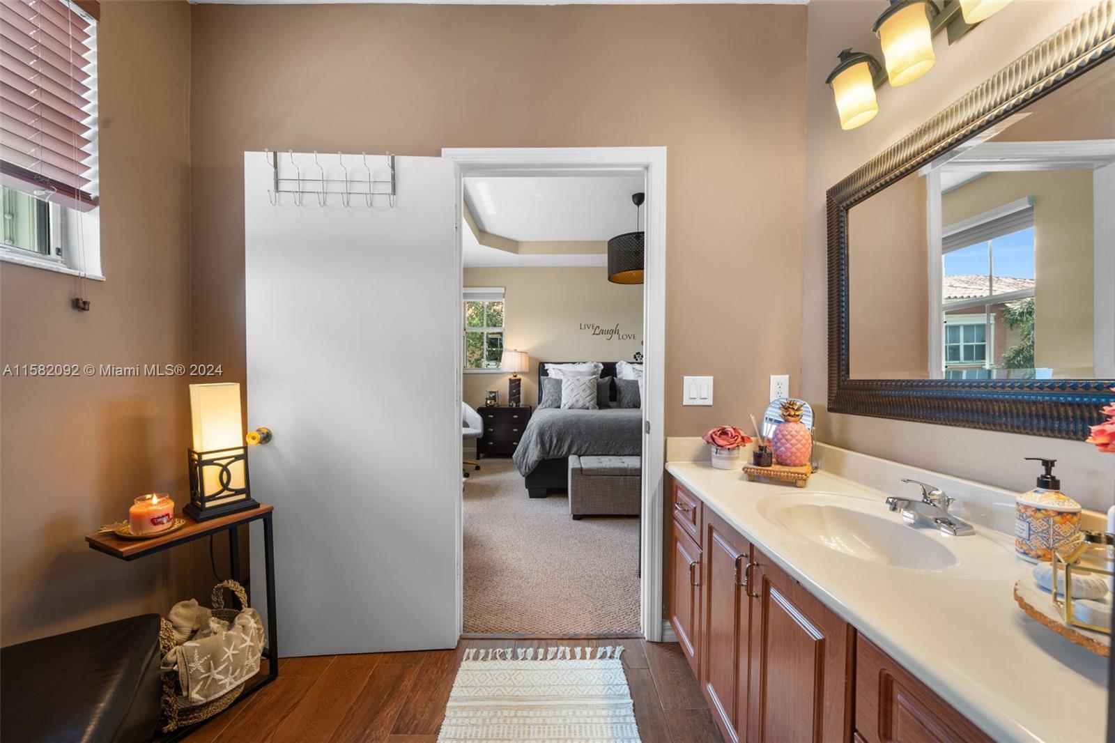 3091 Southwest 153rd Path Miami, FL 33185 - Photo 23 of 34 a en suite bathroom with a double vanity sink and a mirror