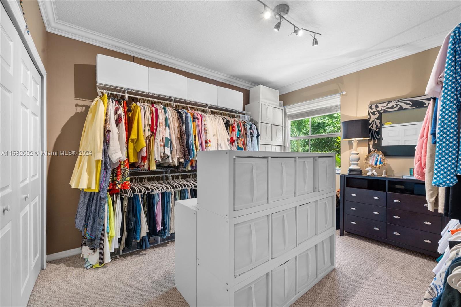 3091 Southwest 153rd Path Miami, FL 33185 - Photo 24 of 34 a view of walk in closet with clothes and shoes