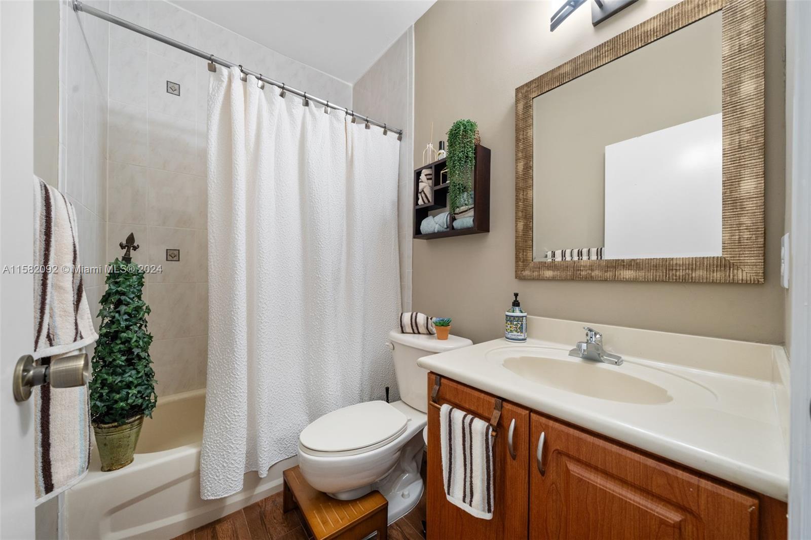 3091 Southwest 153rd Path Miami, FL 33185 - Photo 26 of 34 a bathroom with a sink a toilet and shower