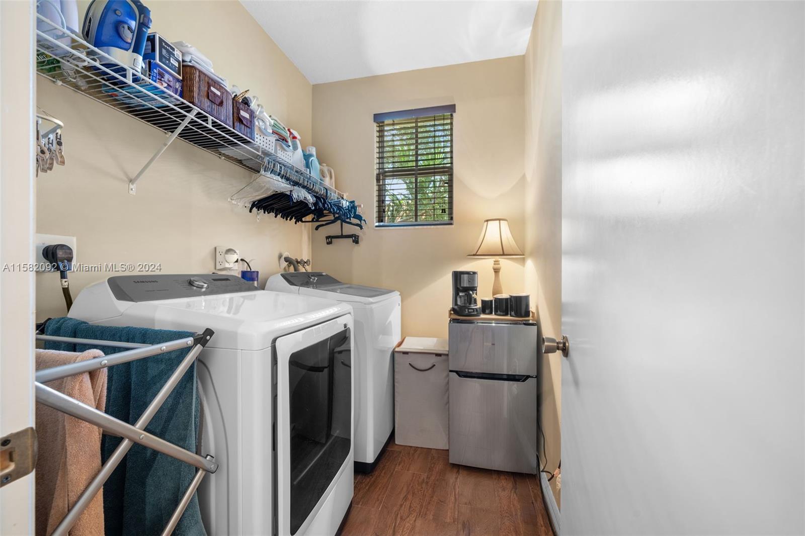 3091 Southwest 153rd Path Miami, FL 33185 - Photo 29 of 34 a utility room with dryer and washer