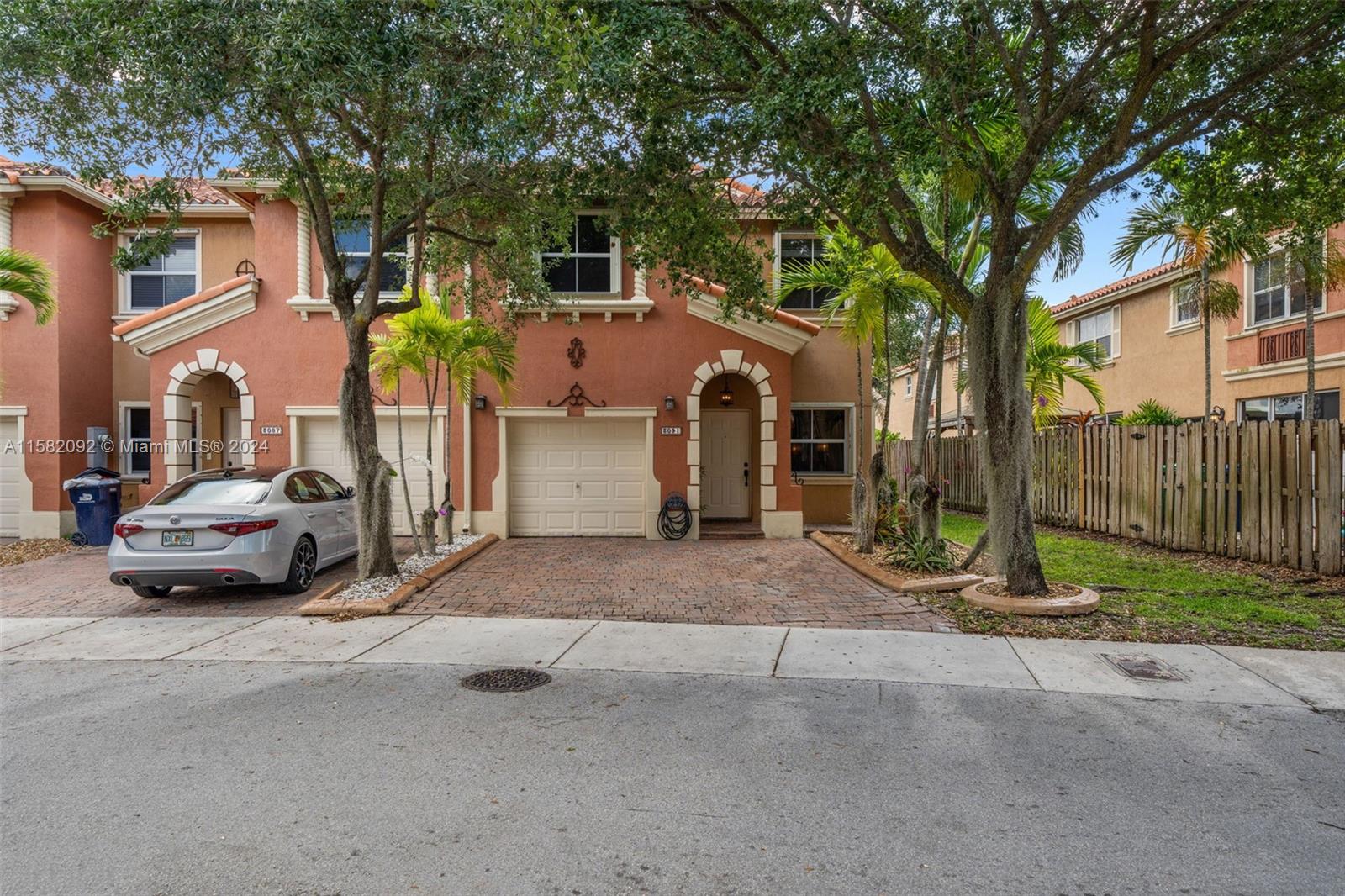3091 Southwest 153rd Path Miami, FL 33185 - Photo 3 of 34 a view of street with parked cars