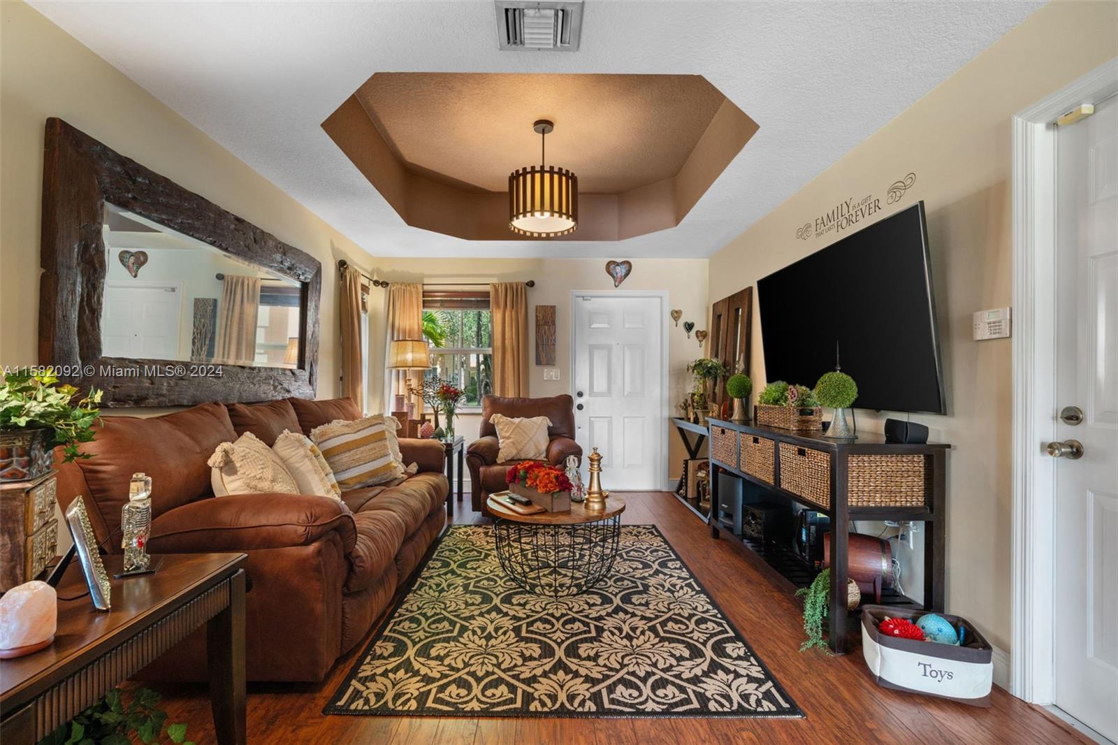 3091 Southwest 153rd Path Miami, FL 33185 - Photo 6 of 34 a living room with furniture and a flat screen tv