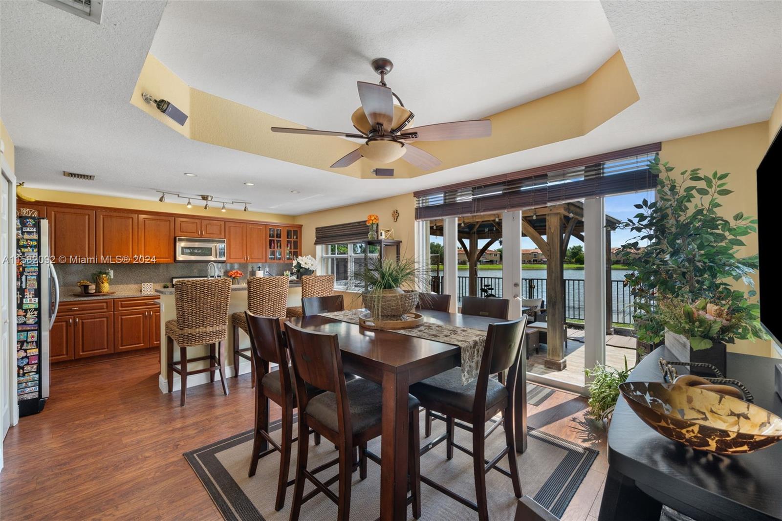 3091 Southwest 153rd Path Miami, FL 33185 - Photo 8 of 34 a view of a dining room with furniture and wooden floor
