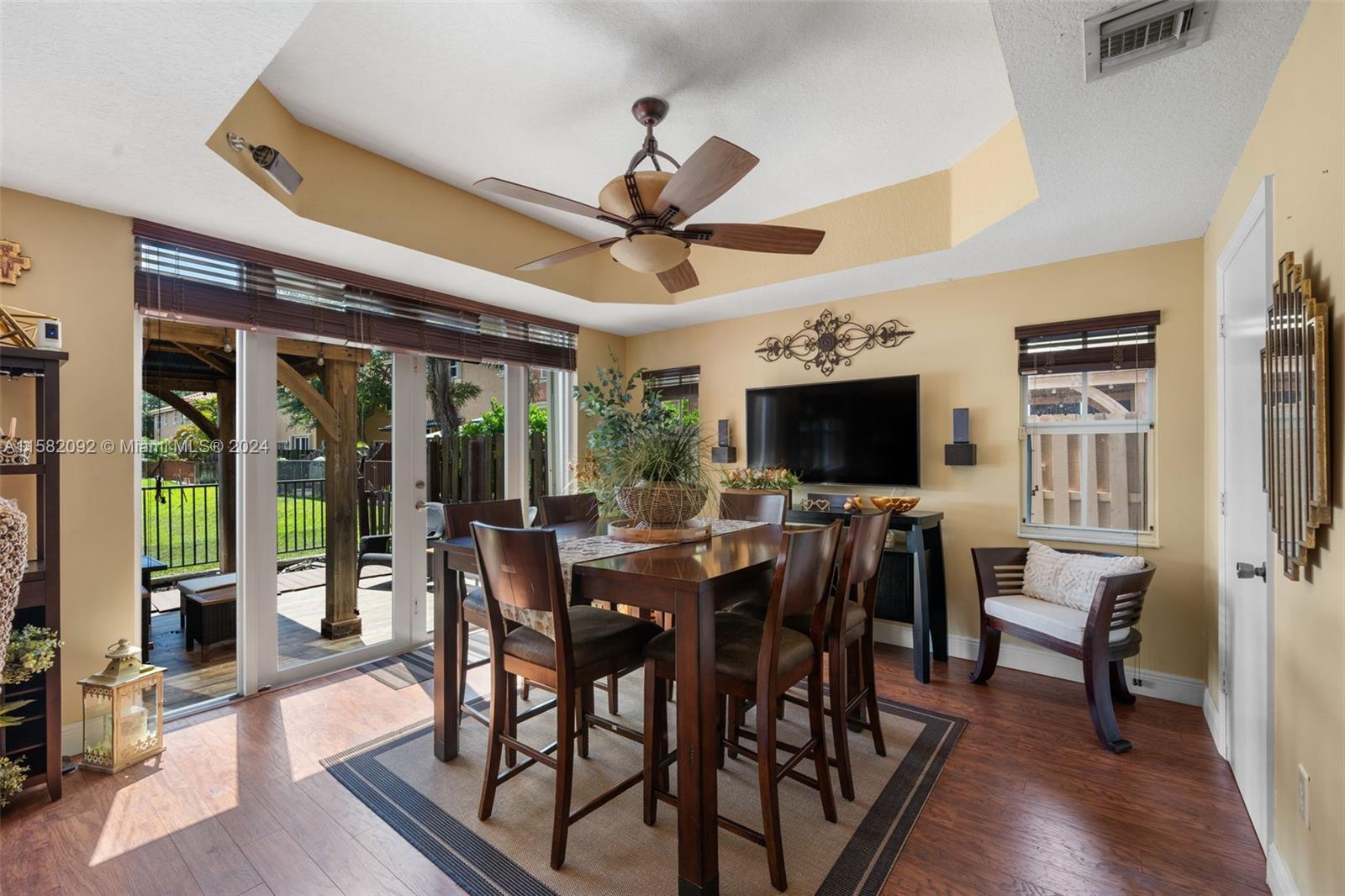 3091 Southwest 153rd Path Miami, FL 33185 - Photo 9 of 34 a view of a dining room with furniture window and wooden floor